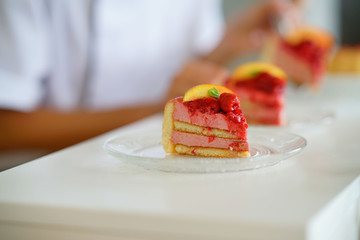 Closeup of raspberry cake set on restaurant table