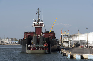 Pusher tug  alongside in Port USA