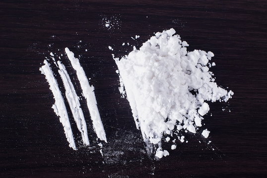 Heroin divided into tracks on the table
