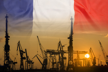 Industrial concept with France flag at sunset