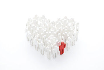 Fototapeta premium Group of people in the shape of a heart with one red person
