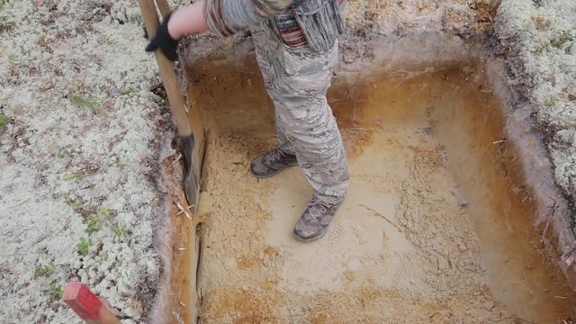 Archeology: rough cleaning of the excavation wall