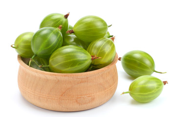 Gooseberry in wooden bowl isolated on white background.