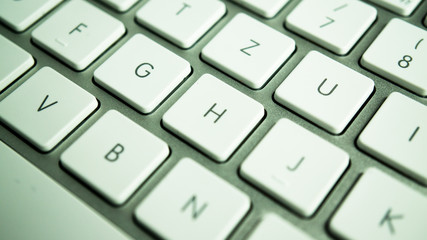 metallic keyboard with white keys