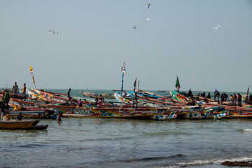 Fishing boats in the Gambia, West Africa - obrazy, fototapety, plakaty