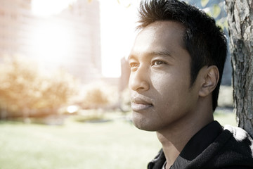 Closeup of asian type man relaxing at the park