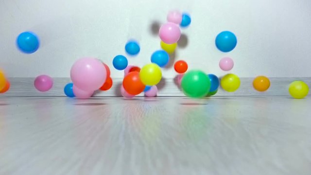 Children balls slowly fall on floor