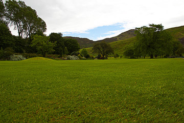 Famous hills of Holyrood Park and the Arthur's seat. View from Holyrood Palace. Edinburgh, Scotland, June.