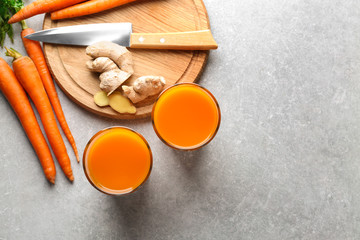 Glasses of carrot juice on light table