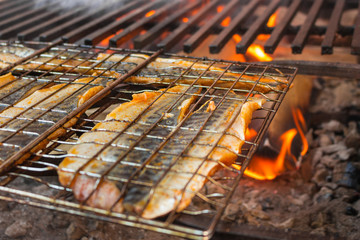 Mackerel is fried on a large grilled chicken fillet