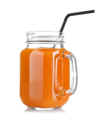 Mason jar of delicious carrot juice, on white background
