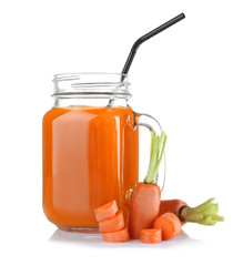 Mason jar of delicious carrot juice with slices, on white background