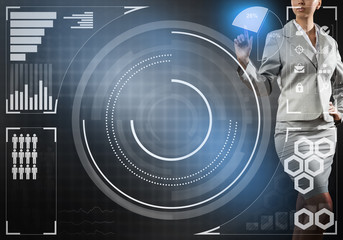 Obraz premium Hand of businesswoman pressing with finger icon on media screen