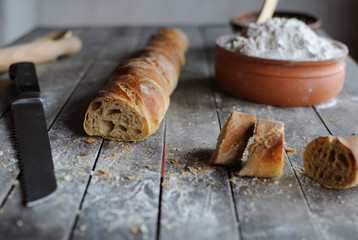 Slices of baguette on a wooden table