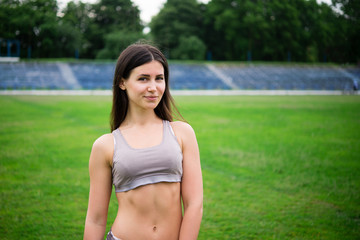 athletic girl standing on the stadium