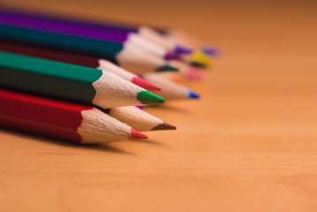 Obraz premium Color pencils on wood background close up