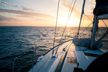 Sailing yacht at sunset in the open sea