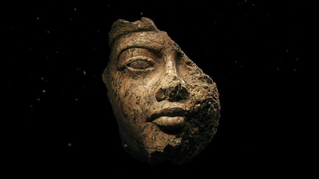 Damaged Ancient Face Carving