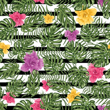 Tropical leafs and flowers seamless pattern background