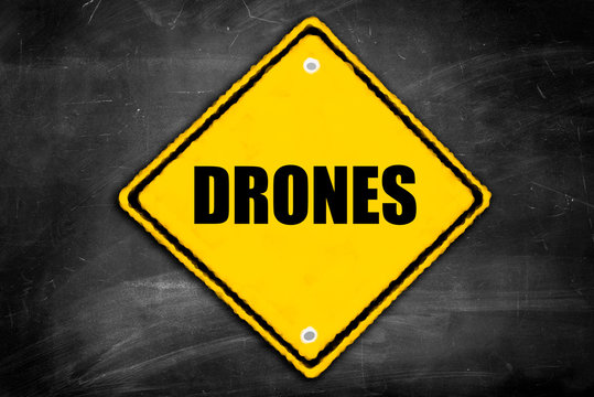 drones written on caution sign