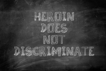 heroin does not discriminate message on chalk board
