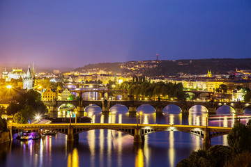 Fototapeta na wymiar Prague at twilight blue hour, view of Bridges on Vltava
