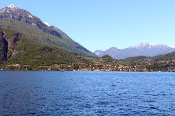 Fototapeta na wymiar Beautiful little village on the shore of the Como lake near the mountain
