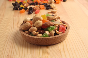 Dried fruits on a wooden background