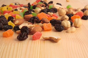 Dried fruits on a wooden background