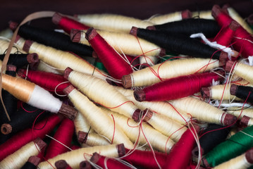 Colorful of sewing threads in the bamboo tray.