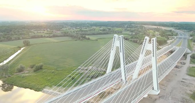 Aerial view of the new modern empty bridge at sunset time. Poland, Krakow