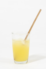 Beverage with wooden straw on white background