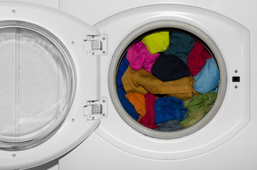 Washing machine, colorful clothes. Pile of laundry. - 162574114
