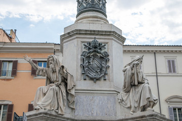 Fototapeta na wymiar Biblical Statues at Base of Colonna dell'Imacolata