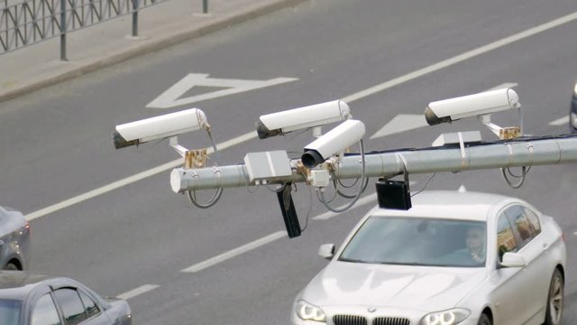 Closeup of four traffic security camera surveillance CCTV on the road in the big city