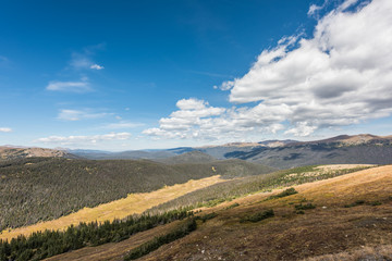Naklejka na ściany i meble Overlook of Rocky Mountains with plains and pine forest in Colorado