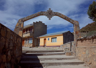 Fototapeta na wymiar An archway with an Inca Cross in a traditional community on the Isla del Sol on Lake Titicaca