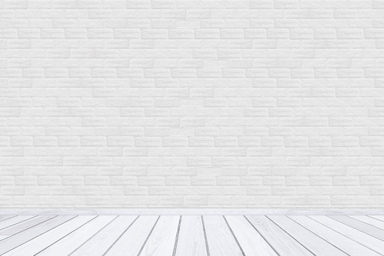 White brick wall texture with wood floor.
