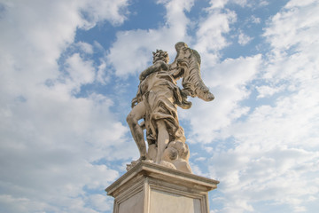 Fototapeta na wymiar Bernini's marble statue of angel from the Sant'Angelo Bridge in Rome, Italy