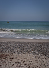 Yellow boat in the Ocean off of Capistrano Beach
