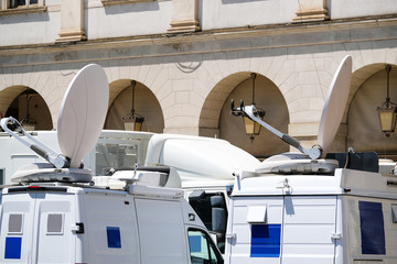 Milan, Italy - June, 19, 2017: vans with TV equipment near La Scala opera theatre in Milan, Italy