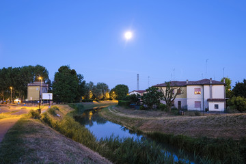 Obraz premium Venice, Italy, June, 9, 2017: night landscape with the image of channel in Rovigo, Italy