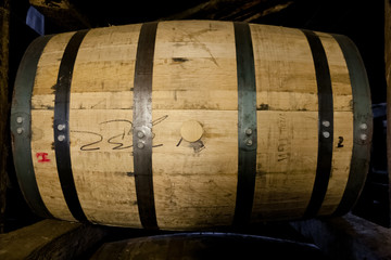 Whiskey or bourbon barrel aging in a distillery warehouse