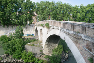 Ponte Fabricio and Isola Tiberina in Rome, Italy. Fabricius Bridge is the oldest Roman bridge in Rome