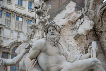Fototapeta na wymiar Fountain of the Four Rivers (Fontana dei Quattro Fiumi) and Agonale obelisk at Piazza Navona square