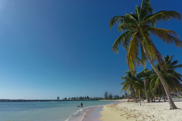 playa giron, Cuba &ndash; January 2, 2017: Tropical Beach view with people in Playa Giron, Cuba