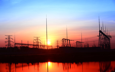 Fototapeta na wymiar High voltage substation in the setting sun