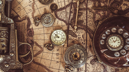 Fototapeta na wymiar Watch Necklace On Old World Map