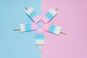 Ice cream over blue and pink background