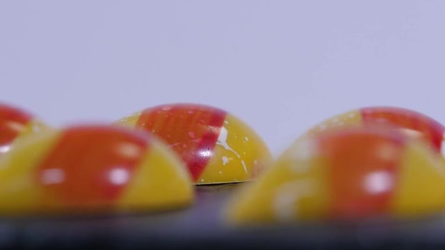 shiny caramel candies. Caramel candies. Row of color caramel candies isolated on a white background.